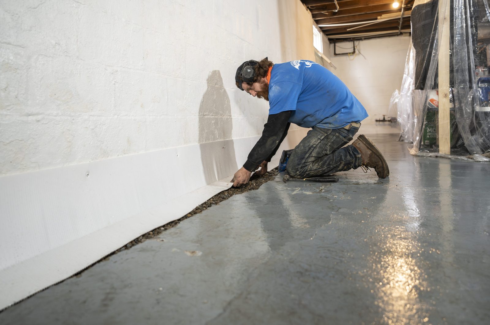 Interior basement waterproofing work in progress